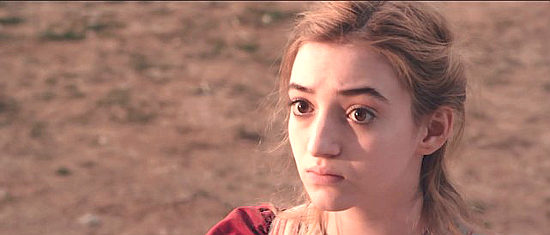 Anna Harr as Ruth, a newly orphaned girl kidnapped by Royce's gang in Eminence Hill (2019)
