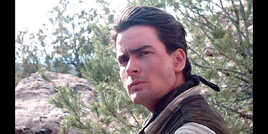 Charlie Sheen as Dick Brewer, one of the regulators in Young Guns (1988)