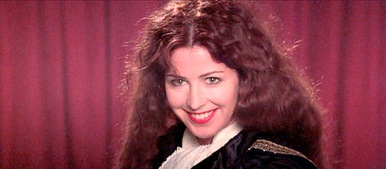 Dana Delany as Josephine Marcus, playing the devil on stage in Tombstone (1993)