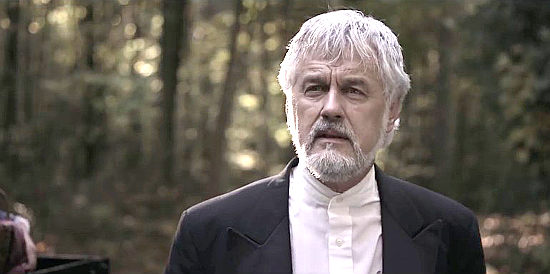 Dean Teaster as Preacher Collins, Emmett's former father-in-law in Wild Faith (2018)