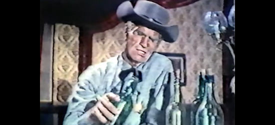 Gordon Mitchell as Deputy Sheriff Lead, looking to drink some trouble away in A Gunman Called Dakota (1972)