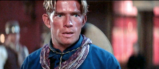 Thomas Haden Church as Billy Clanton, under the gun in Tombstone (1993)