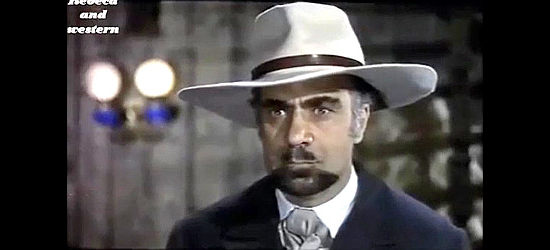 Vincenzo Cascino as the banker Vermont, disagreeing with outlaw Alan in The Sheriff Won't Shoot (1965)