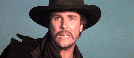 William Peterson as Pat Garrett, a sheriff spotting his prey in Young Guns II (1990)
