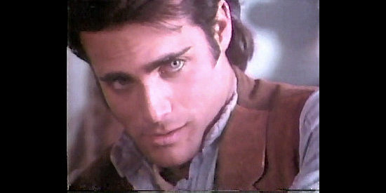 Brian Bloom as Zack Hollister, considering a request from the woman who saved his life in Brotherhood of the Gun (1991)