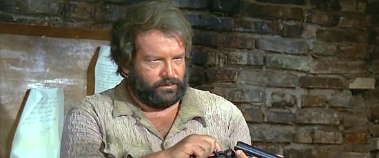 Bud Spencer as Bambino, loading a shotgun in case trouble comes calling in They Call Me Trinity (1970)