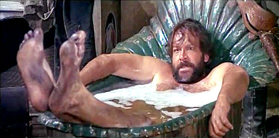 Bud Spencer as Bambino, taking a rare bath and surprised by a Trinity reunion in Trinity is Still My Name (1971)