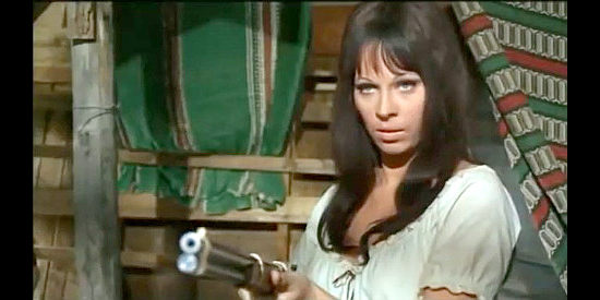 Cristina Penz as Consuelo, Fernando's lover, deciding it's time for her to take up arms in Pray to God and Dig Your Grave (1968)
