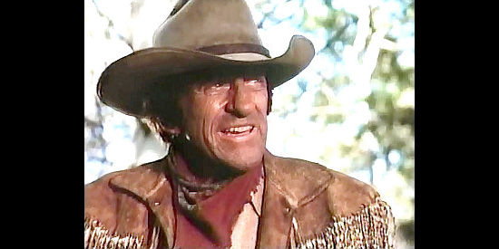 James Arness as Matt Dillon, ready to ride to the gunfire in Gunsmoke, Return to Dodge (1987)