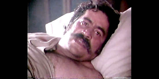 Jorge Cervera Jr. as Charlie Sanchez, the sheriff who takes Zack under his wing in Brotherhood of the Gun (1991)