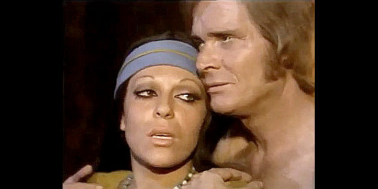 Maily Doria as Adelita in a rare tender moment with Dino Strano as Chad Randall in His Colt, Himself, His Revenge (1973)
