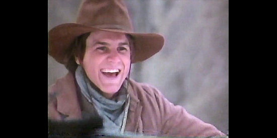 Mark Ballou as Tom Hollister, the brother Zack leads to an outlaw life in Brotherhood of the Gun (1991)