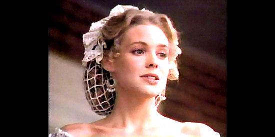 Olivia d'Abo as Emily Doyle, the pretty cousin who resents Rebecca's marriage to Andrew Jackson Doyle in For Love and Glory (1993)