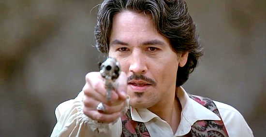 Robert Beltran as El Diablo, the bandit who robs a bank and kidnaps a prize student in El Diablo (1990)