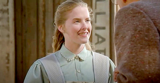 Sarah Trigger as Nettie Tuleen, flashing an adoring smile at her teacher in El Diablo (1990)