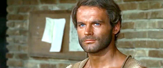 Terence Hill as Trinity spots potential trouble in town in They Call Me Trinity (1970)