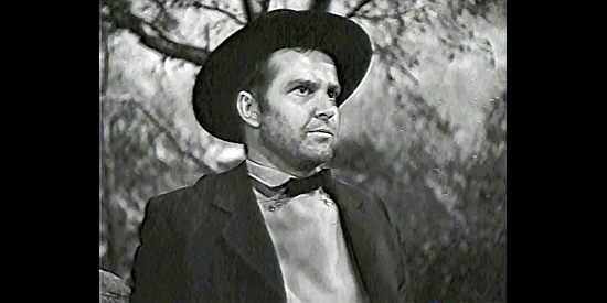 Alan Baxter as Jesse James, hoping to include the Younger Brothers in his gang in Bad Men of Missouri (1941)