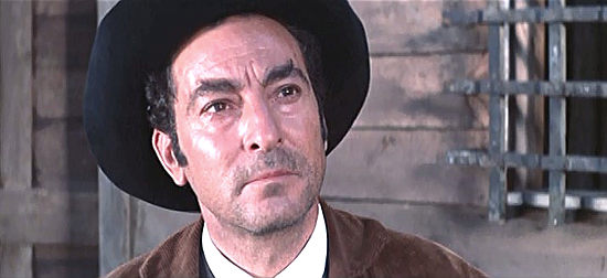 Alfredo Varelli (Fred Warell] as a sheriff warning Johnny Ashley (Anthony Steffen) about taking the law into his own hands in Seven Dollars on the Red (1966)