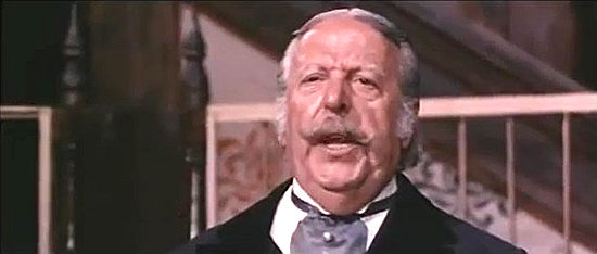Angel Alvarez as Bill, the auctioneer taking directions from Grant in Tedeum (1972)