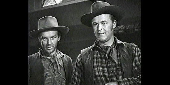 Arthur Kennedy as Jim Younger and Wayne Morris as Bob Younger makes an unexpected acquaintance during a train robbery in Bad Men in Missouri (1941)