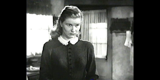 Barbara Bel Geddes as Amy Lofton, fretting because she's falling for a gunman in Blood on the Moon (1948)