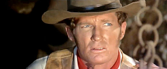 Brad Harris as Django, looking to clear his name and settle an old score in Death is Sweet from the Soldier of God (1972)