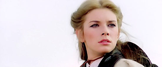 Cinzia Monreale as Margaret Barrett, wondering whether the newcomer named Roy Blood can be trusted in Silver Saddle (1978)
