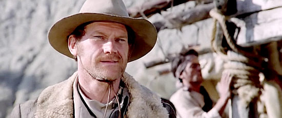 Donald O'Brien as Fletcher, one of Barrett's men, delivering a ransom in Silver Saddle (1978)