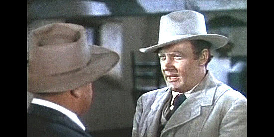 Ian Hunter as Eric Keating tries to reason with Dan Hickey in Billy the Kid (1941)