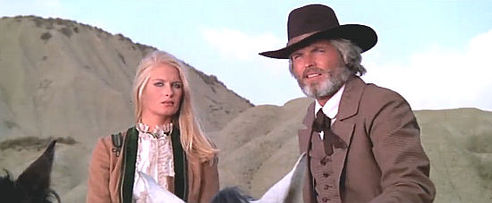 Jenny Atkins as Maggie Thompson with her father Jack Sacramento Thompson (Ty Hardin) watching a fight in You're Jinxed Friend, You've Met Sacramento (1972)