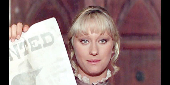 Orchidea De Santis as Janet Sullivan comes up with a key piece of evidence in Prey of the Vultures (1972)