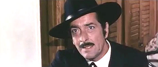 Riccardo Garrone as the sheriff, bound for a reunion of Texas sheriffs when he runs in two shysters on a train in Tedeum (1972)