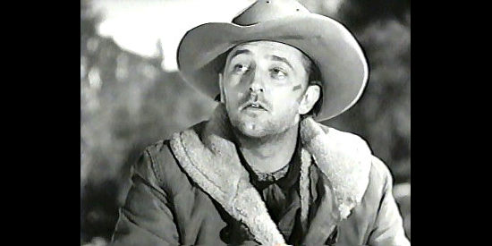 Robert Mitchum as Jim Garry, a man with a plan to save the Lofton herd in Blood on the Moon (1948)