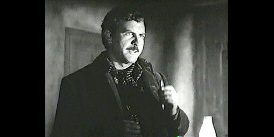 Robert Preston as Tate Riling, explaining his plan to old friend Jim Garry in Blood on the Moon (1948)