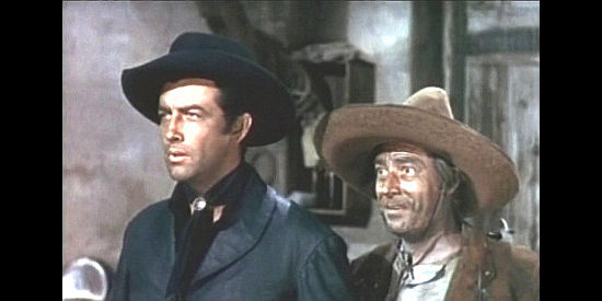 Robert Taylor as Billy and Frank Puglia as Pedro Gonzalez, considering an offer of jobs on the Keating ranch in Billy the Kid (1941)