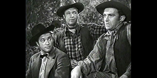 The Younger Brothers, Dennis Morgan as Cole, Wayne Morris as Bob and Arthur Kennedy as Jim, contemplate a partnership with Jesse James in Bad Men of Missouri (1941)