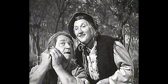 Wallace Beery as Big Jack and Marjorie Main as Flapjack Kate listen to a stolen watch in Big Jack (1949)