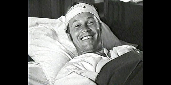 Wayne Morris as Bob Younger, cheerful while recuperating in Bad Men of Missouri (1941)