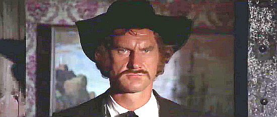 Donald O'Brien as Frank O'Shaughnessy, ruler of Abilene and kidnapper of women in Six Bounty Killers for a Massacre (1973)