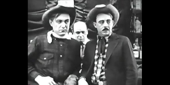 Harry Carey as Cheyenne Harry and Vester Pegg as Placer Fremont, old friends about to wind up on opposite sides in a fight over water rights in Straight Shooting (1917)