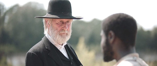James Cromwell as John Brown, welcoming Shields Green to his armed militia in Emperor (2020)