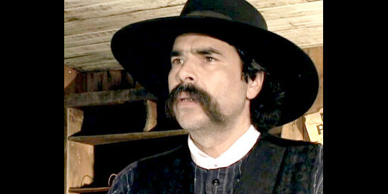 Miguel Cornoa as Deputy Alan Conley, always eager to display his gun skills in Sheriff of Contention (2010)