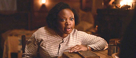 Naturi Naughton as Sarah Green, expressing fear over what will happen if her son is caught reading a book in Emperor (2020)
