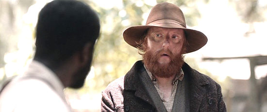 Patrick Roper as Hank Beaumont, the cruel overseer of the Stevens' plantation in Emperor (2020)