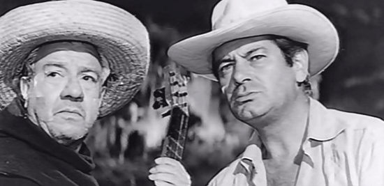 Roberto Font as Padre Francisco and Jose Suarez as Jose Mendoza, trading lyrics with Lolita in The Jaguar (1963)