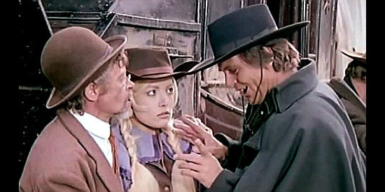 Craig Hill as Mace Cassidy turns his attention to Toni Pickford (Agata Lys) during a stage holdup as her pa looks on in In the Name of the Father, the Son and the Colt (1971)