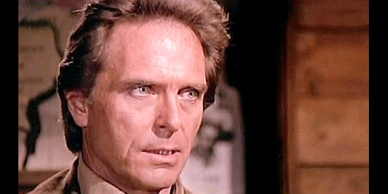 Craig Hill as Sheriff Bill Nolan, a man with a murder to solve and a name to clear in In the Name of the Father, the Son and the Colt (1971)