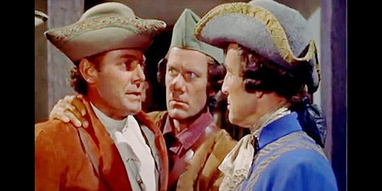 Jon Hall as Prince Hannoc, being held back by Gist (John Ridgely) after being challenged by Appleby (William Blakewell) in When the Redskins Rode (1951)