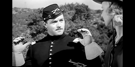 Alan Curtis as Capt. Fred Raymond, finding himself under Jean Shelby's gun in Renegade Girl (1946)