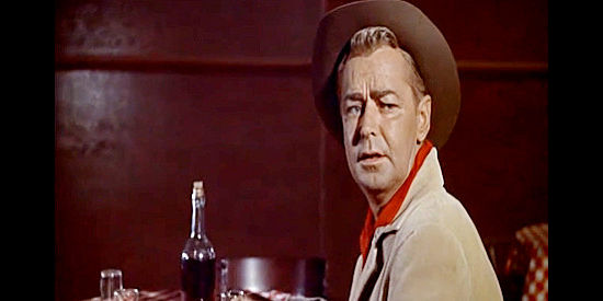 Alan Ladd as Jim Hadley, coming to realize he and his logging crew will never be accepted in the town of Deep Wells in Guns of the Timberland (1960)